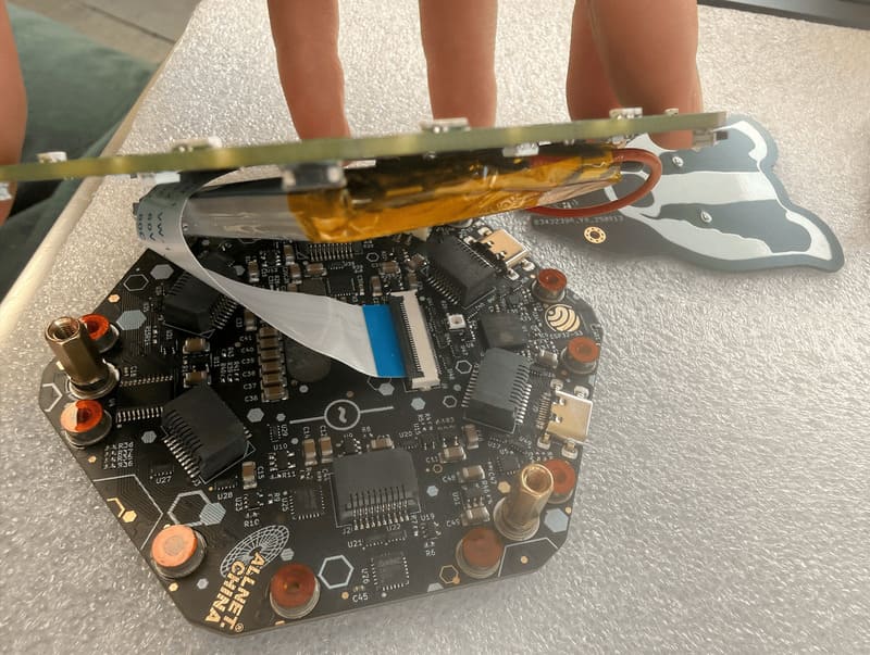 Unscrewing the three frontboard screws
