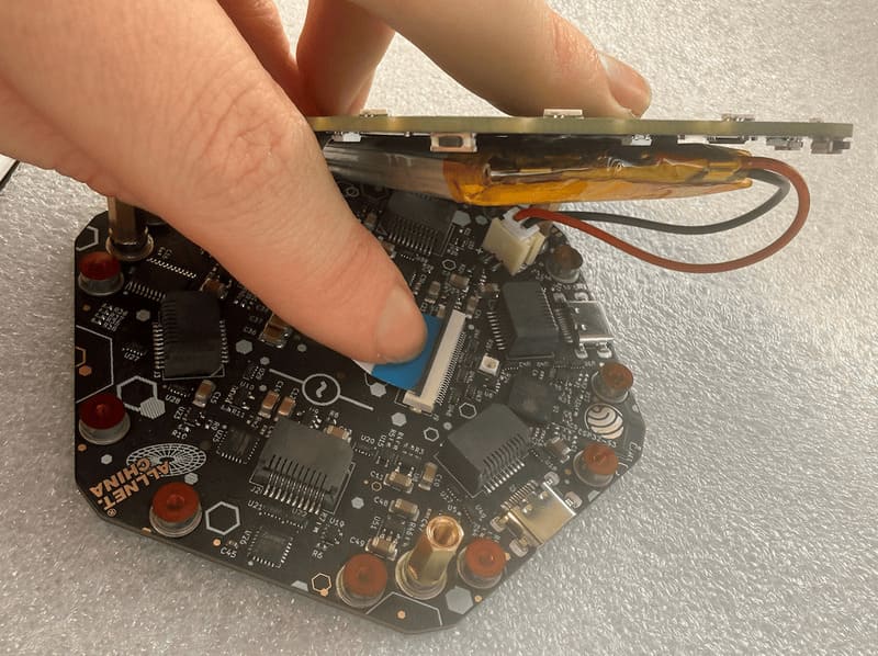 Lifting the frontboard to reach the display cable