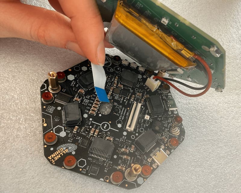 Sliding the ribbon cable out of the connector