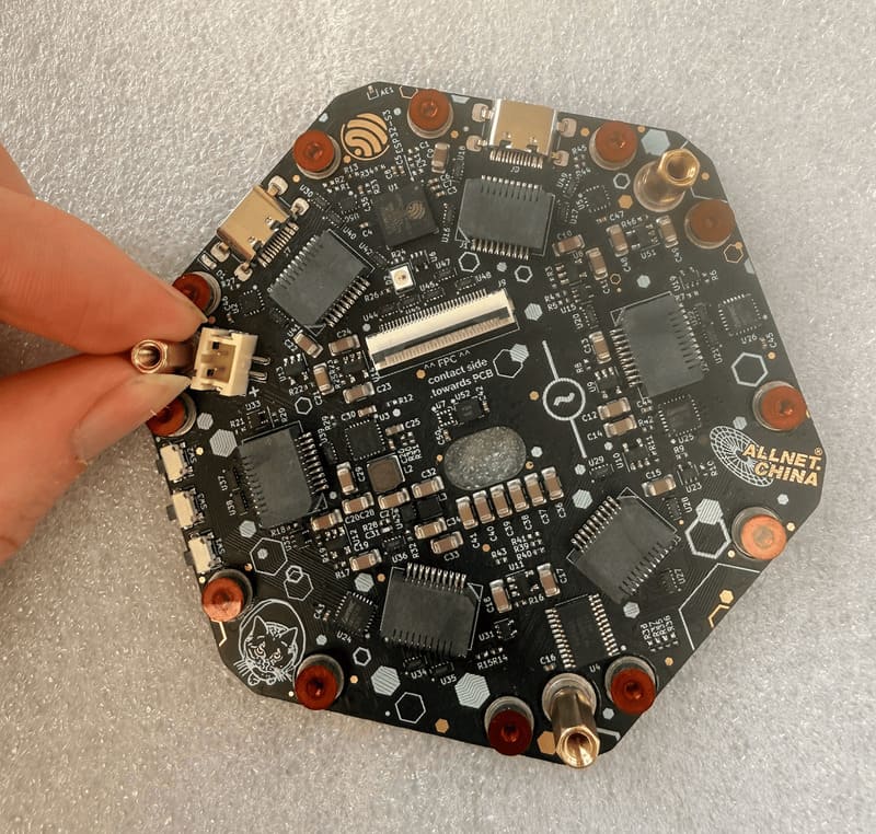 Removing the golden standoffs from the base board