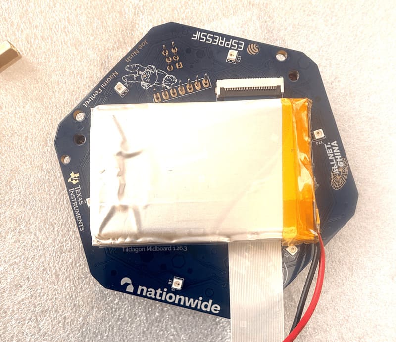 Battery attached over the display cable